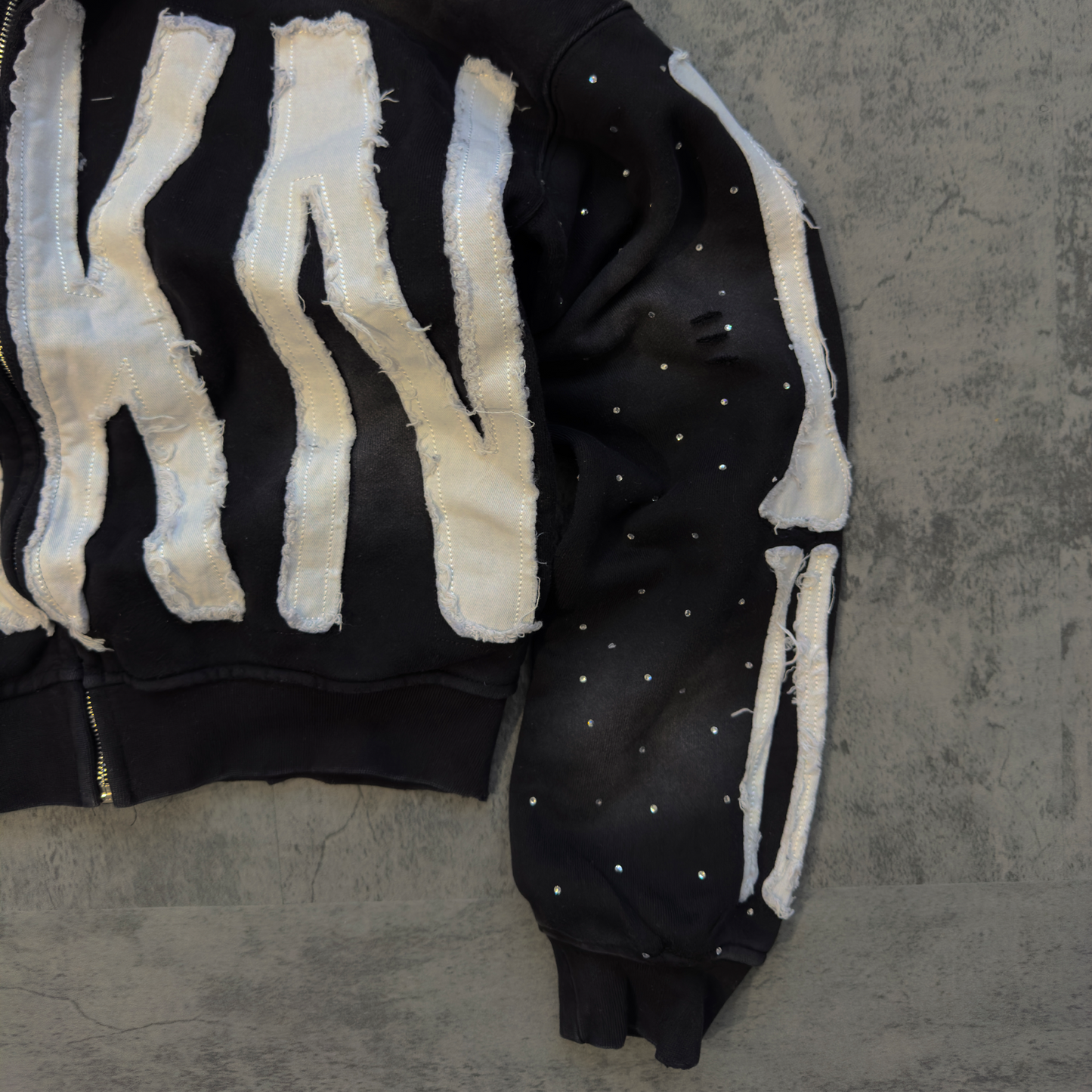 “TRKN” cropped distressed rhinestone zip up hoodie